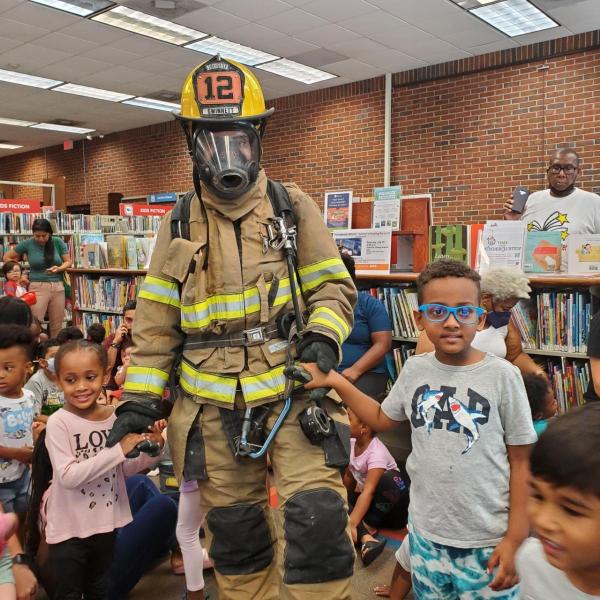 Fireman posing with children