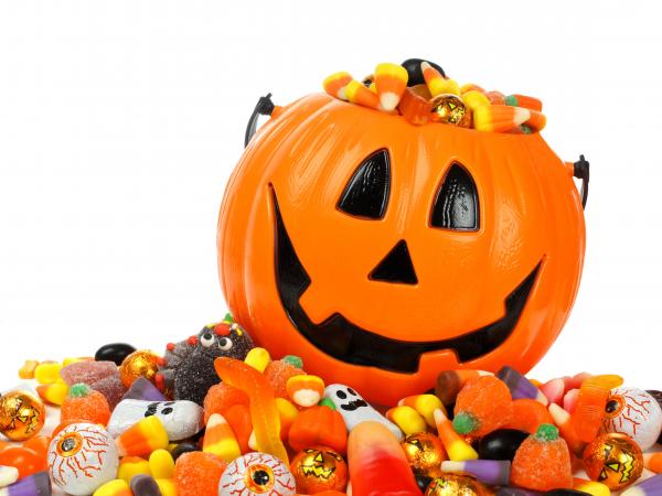 A Halloween container full of candy.