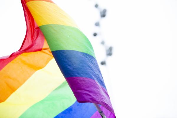 Rainbow Pride flag blowing in the wind. 