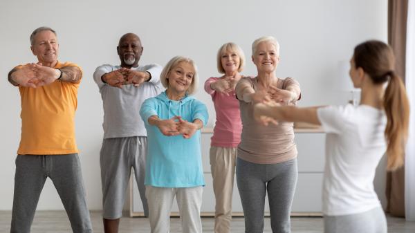 A group of mature adults practicing yoga. 